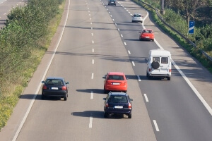 Traffic on the road where a driver is being followed closely.